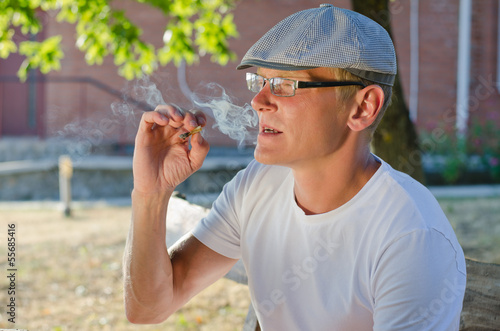Photo: Man smoking a cigarette or joint Man smoking a cigarette or joint