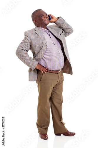 Photo: senior african man talking on cell phone senior african man talking on cell phone