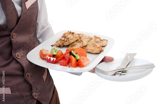 Photo: Waiter is offering grilled meat and vegetables Waiter is offering grilled meat and vegetables