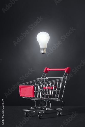 Photo: shone electric bulb and shopping trolley shone electric bulb and shopping trolley