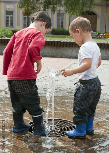 Photo: Children playing with water fountain Children playing with water fountain