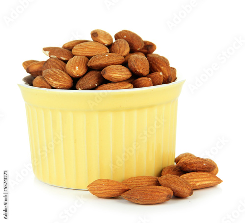 Photo: Almond in bowl, isolated on white Almond in bowl, isolated on white