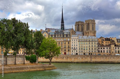 Photo: Notre Dame de Paris and parisian buildings. Notre Dame de Paris and parisian buildings.