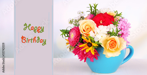 Photo: Beautiful bouquet of bright flowers in color mug, Beautiful bouquet of bright flowers in color mug,