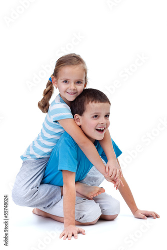 Photo: Happy kids playing and wrestling on the floor Happy kids playing and wrestling on the floor