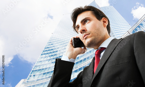 Photo: Businessman talking on the phone Businessman talking on the phone
