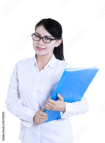 Photo: Attractive female doctor holding folder Attractive female doctor holding folder