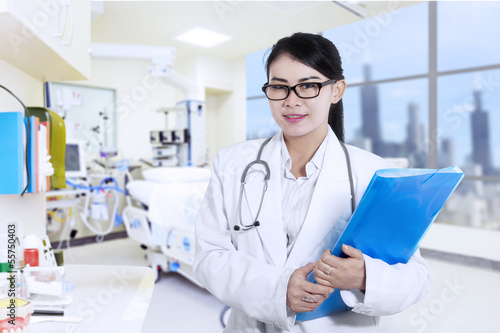 Photo: Happy female doctor at the hospital Happy female doctor at the hospital