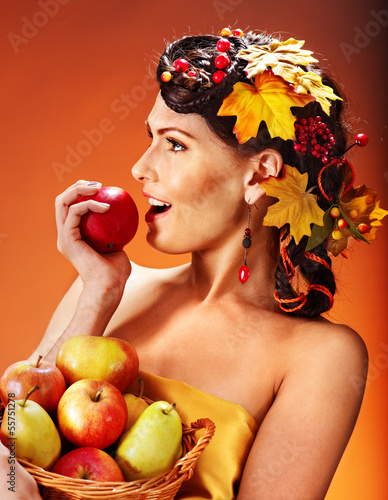 Photo: Woman holding autumn basket. Woman holding autumn basket.