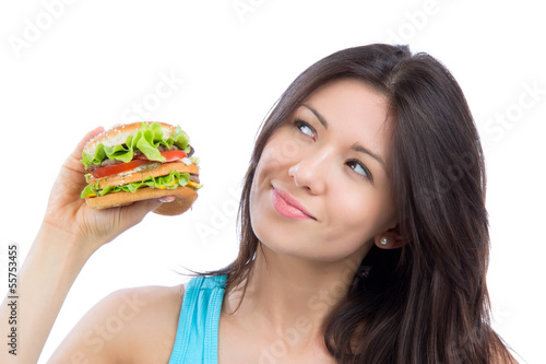 Photo: woman with tasty fast food unhealthy burger in hand to eat woman with tasty fast food unhealthy burger in hand to eat