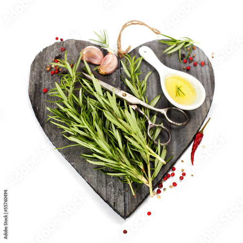Photo: Fresh spices on heart shaped cutting board Fresh spices on heart shaped cutting board