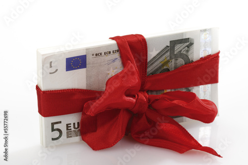 Photo: Bündel von Banknoten als Geschenk gebunden Bündel von Banknoten als Geschenk gebunden