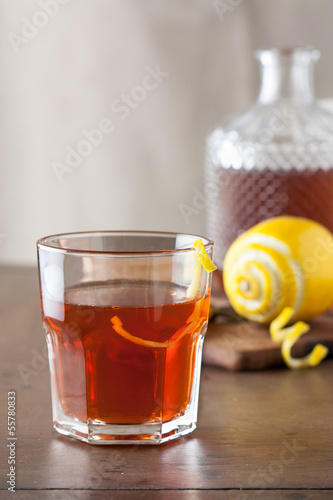 Photo: Classic sazerac cocktail on wooden table Classic sazerac cocktail on wooden table