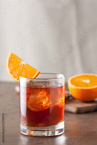 Photo: Classic negroni cocktail on wooden table Classic negroni cocktail on wooden table