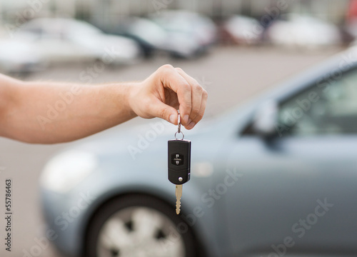 Photo: man with car key outside man with car key outside