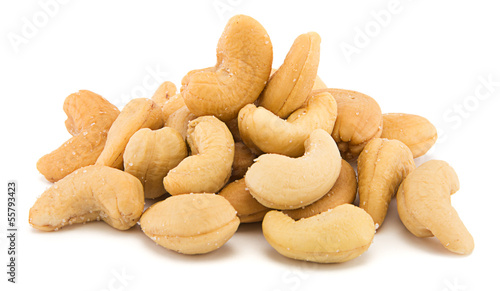 Photo: Heap of cashew nuts isolated on white background Heap of cashew nuts isolated on white background