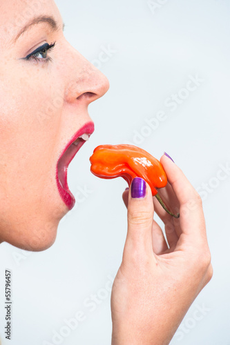 Photo: woman eating Habanero chilli woman eating Habanero chilli