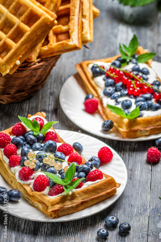 Photo: Waffles with fresh berry fruit and mint leaf Waffles with fresh berry fruit and mint leaf