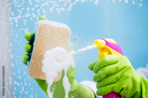 Photo: Cleaning - cleaning window pane with detergent Cleaning - cleaning window pane with detergent