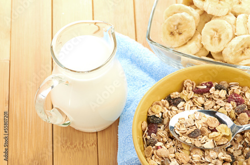 Photo: Delicious and healthy cereal in bowl with milk Delicious and healthy cereal in bowl with milk