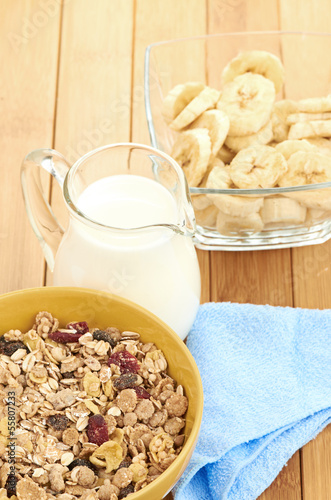 Photo: Delicious and healthy cereal in bowl with milk Delicious and healthy cereal in bowl with milk