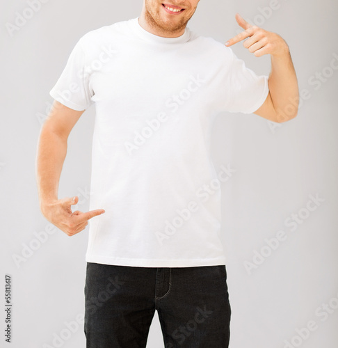 Photo: man pointing at blank white t-shir man pointing at blank white t-shir
