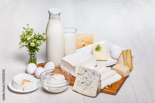 Photo: milk and food on wooden background milk and food on wooden background