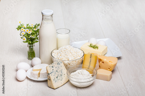 Photo: milk and food on wooden background milk and food on wooden background
