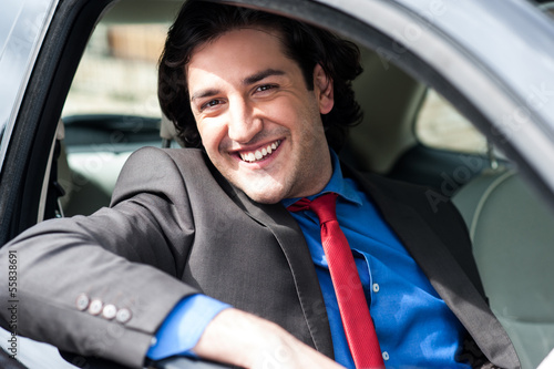 Photo: Portrait of handsome guy driving his car Portrait of handsome guy driving his car