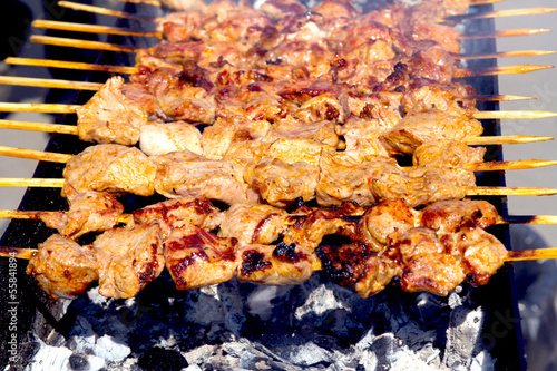 Photo: skewers of pork on wooden sticks skewers of pork on wooden sticks
