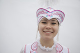 Photo: Portrait of young smiling woman in traditional clothing from Kazakhstan, studio shot Portrait of young smiling woman in traditional clothing from Kazakhstan, studio shot