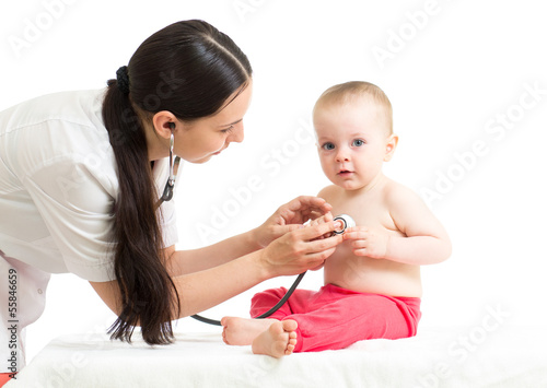 Photo: doctor examining baby girl isolated on white background doctor examining baby girl isolated on white background