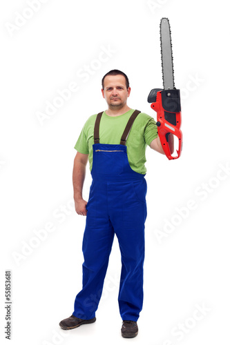 Photo: Proud construction worker with chainsaw Proud construction worker with chainsaw