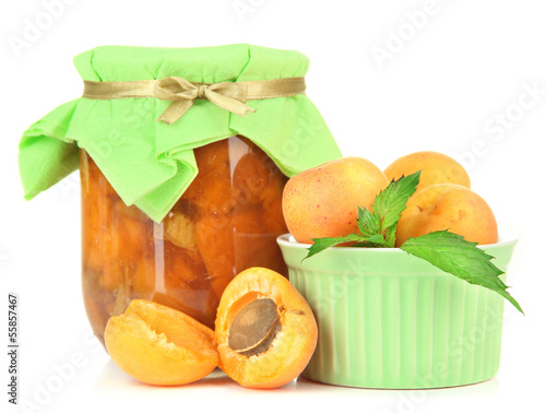Photo: Apricot jam in glass jar and fresh apricots, isolated on white Apricot jam in glass jar and fresh apricots, isolated on white