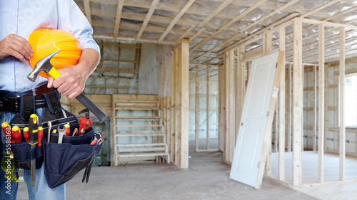 Photo: Handyman with a tool belt. Handyman with a tool belt.