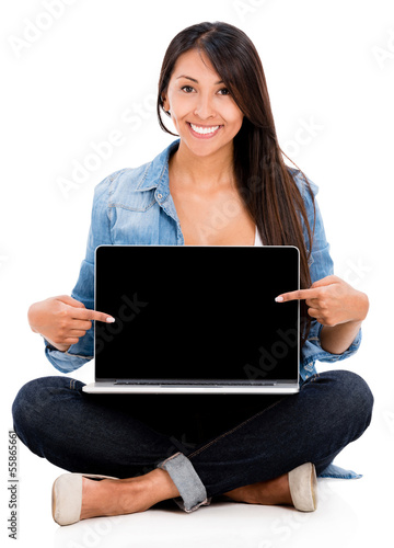 Photo: Woman pointing at a laptop screen Woman pointing at a laptop screen