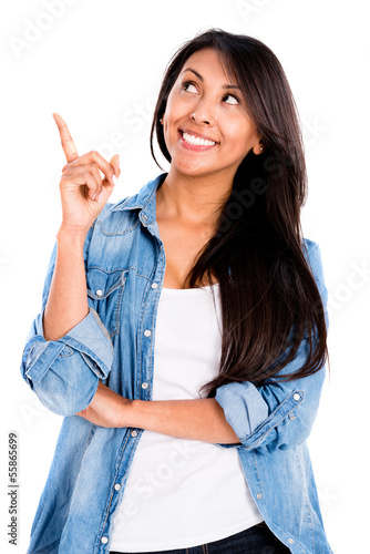 Photo: Happy woman pointing an idea Happy woman pointing an idea