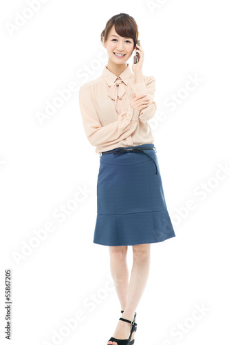 Photo: Beautiful asian business woman using a cellular Beautiful asian business woman using a cellular