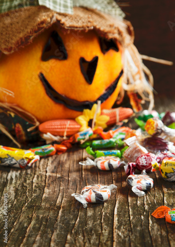 Photo: Colorful Halloween candy and Jack-o-lantern Colorful Halloween candy and Jack-o-lantern