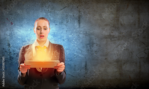 Photo: Young business woman with ipad Young business woman with ipad