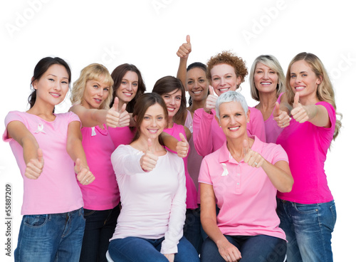 Photo: Cheerful women posing and wearing pink for breast cancer Cheerful women posing and wearing pink for breast cancer