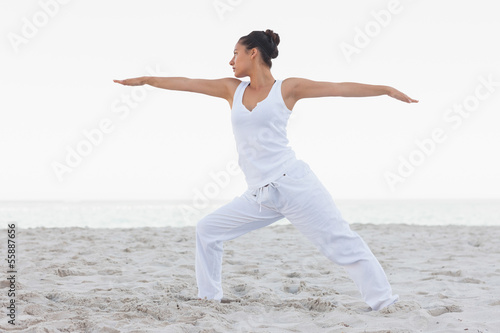 Photo: Brunette woman stretching in yoga pose Brunette woman stretching in yoga pose