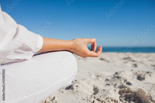 Photo: Close up view of womans hand in yoga pose Close up view of womans hand in yoga pose