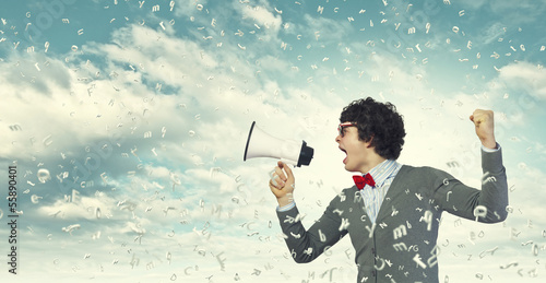 Photo: Young man with megaphone Young man with megaphone