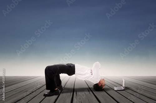 Photo: Businessman bridge position outdoor Businessman bridge position outdoor