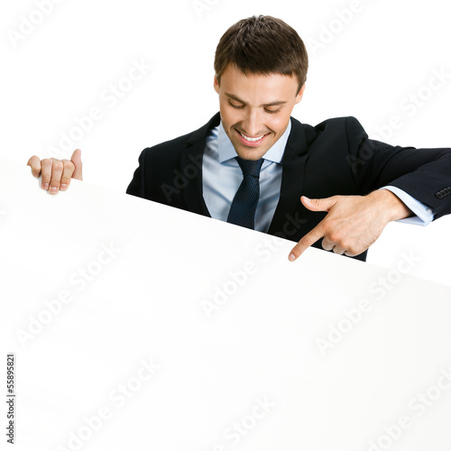 Photo: Businessman showing signboard, on white Businessman showing signboard, on white