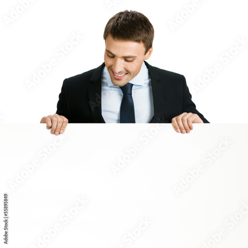 Photo: Businessman showing signboard, on white Businessman showing signboard, on white