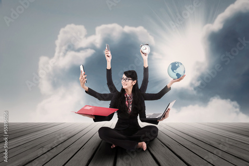Photo: Businesswoman multitasking outdoor Businesswoman multitasking outdoor