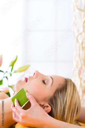Photo: Wellness - woman having aloe vera application Wellness - woman having aloe vera application