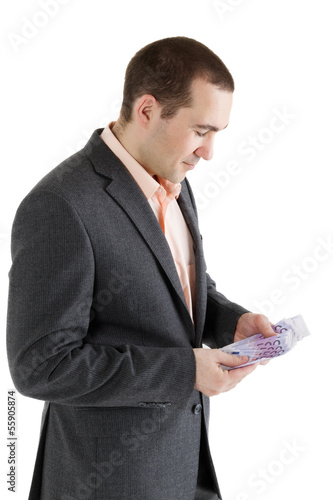 Photo: stack banknotes of 500 euro in hands of man stack banknotes of 500 euro in hands of man